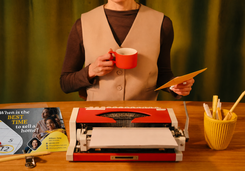 An L&B team member checking a customer's printed campaign before it mails